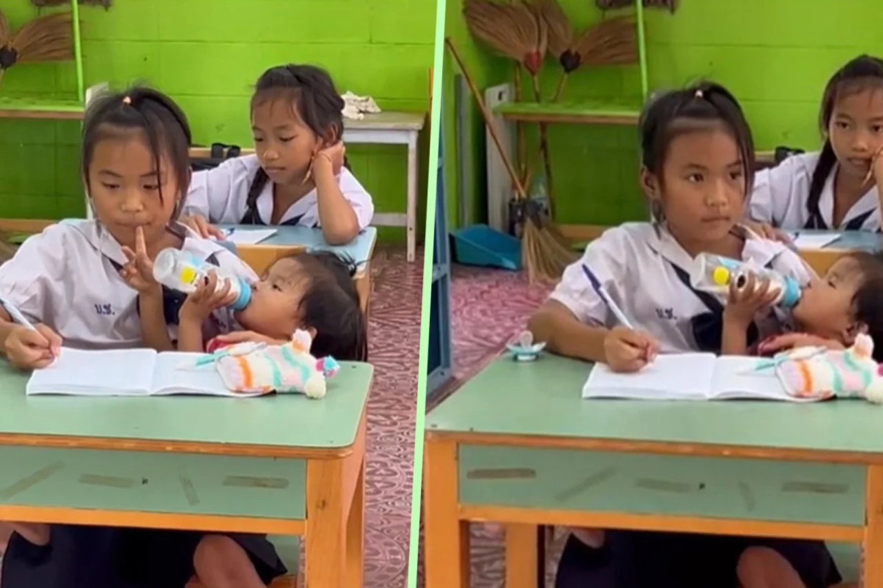 فتاة تتابع دروسها أثناء إطعام شقيقتها الصغيرة تخطف القلوب